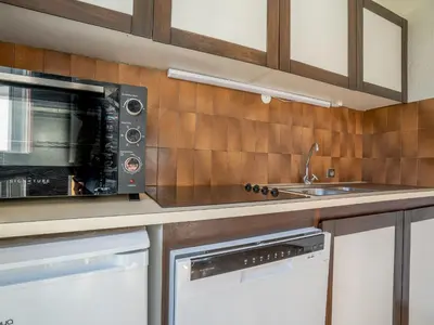 a kitchen with a microwave and a sink at Apartment Le Prarion by Interhome in Les Houches