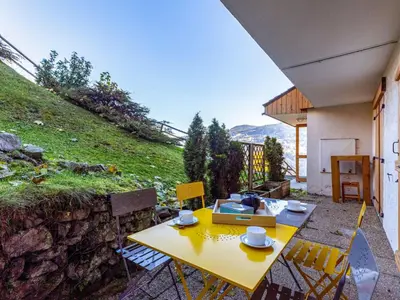 a living room with a yellow couch in a room at Studio Rubis by Interhome in Saint-Gervais-les-Bains