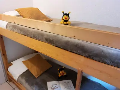 two stuffed animals sitting on top of a bunk bed at Studio Rubis by Interhome in Saint-Gervais-les-Bains