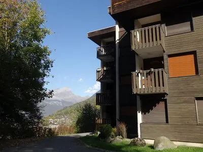 a building with balconies on the side of a road at Apartment Le Diorama-3 by Interhome in Saint-Gervais-les-Bains