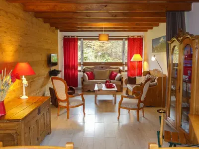 a living room with a couch and a table at Apartment Le Diorama-3 by Interhome in Saint-Gervais-les-Bains