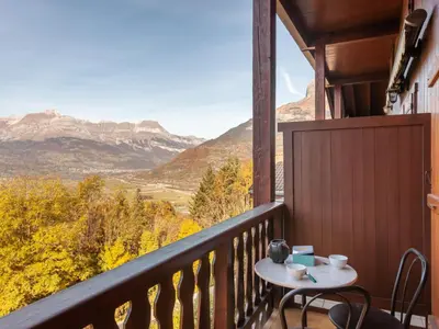 a living room with a table and a couch at Studio la Pointe d'Anterne by Interhome in Saint-Gervais-les-Bains