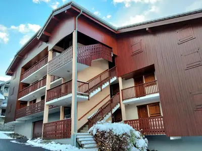 a building with balconies and snow on the ground at Studio la Pointe d'Anterne by Interhome in Saint-Gervais-les-Bains