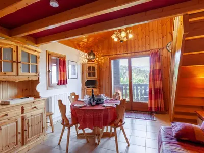 a kitchen with a table and chairs in a room at Studio la Pointe d'Anterne by Interhome in Saint-Gervais-les-Bains