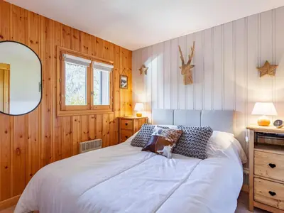 a bedroom with two bunk beds and a dresser at Apartment les Huskies-6 by Interhome in Saint-Gervais-les-Bains