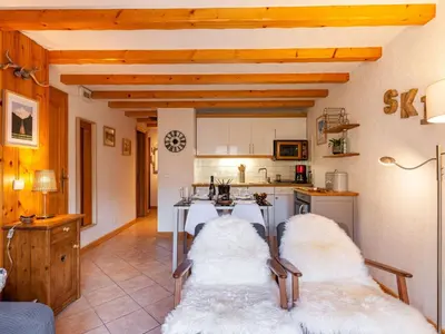 a living room with a table and a couch at Apartment les Huskies-6 by Interhome in Saint-Gervais-les-Bains