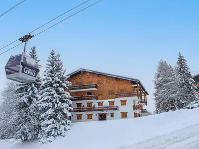 a log cabin in the snow with a driveway at Apartment La Christaz by Interhome in Saint-Gervais-les-Bains