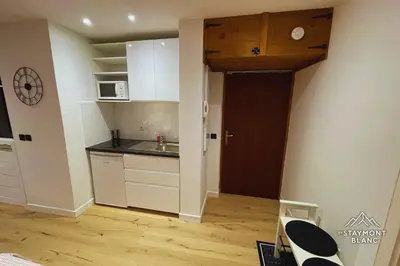 a small kitchen with a sink and a microwave at Charmant 2 pièces cosy au cœur de Saint-Gervais in Saint-Gervais-les-Bains