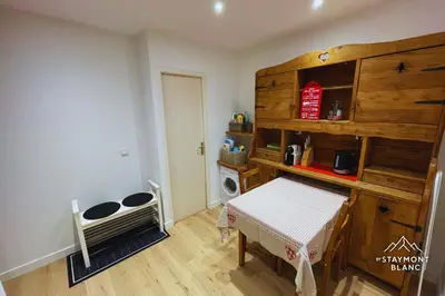 a room with a table and a shelf and a room with a table at Charmant 2 pièces cosy au cœur de Saint-Gervais in Saint-Gervais-les-Bains