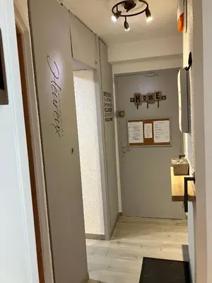 a hallway with a door leading into a room at CHAMONIX CENTRE le Grepon in Chamonix-Mont-Blanc