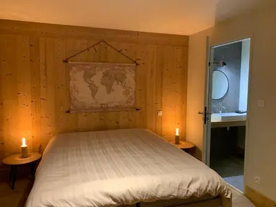 a bathroom with a shower with a glass door at CHALET Mitoyen LE RUSTICANA in Chamonix-Mont-Blanc
