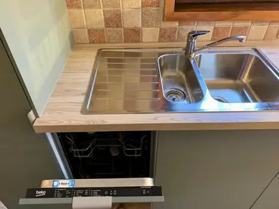 a kitchen counter with a sink and a stove at Gorgeous Mini-Chalet Chamonix in Chamonix-Mont-Blanc
