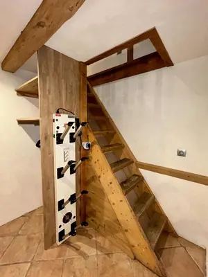 a room with a bunch of wine bottles on a wall at Gorgeous Mini-Chalet Chamonix in Chamonix-Mont-Blanc