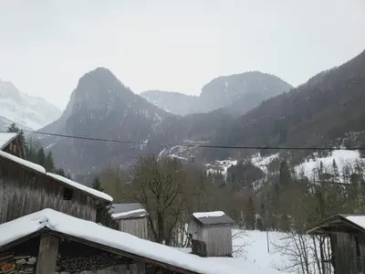 a snow covered valley with mountains in the background at La Ferme De Fernand in Sixt