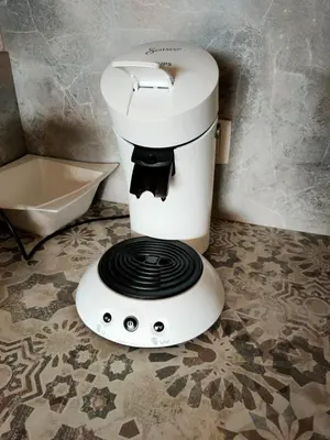 a coffee maker sitting on the floor in a bathroom at appartement Shangrila in Chamonix-Mont-Blanc