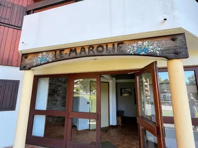 a sign over the door of a restaurant at Appartement cosy proche centre et skibus, parking inclus - FR-1-624-90 in Samoëns