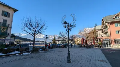 a street light on a sidewalk in a town at Studio sympa a saint Gervais les bains in Saint-Gervais-les-Bains