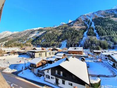 a small town in the mountains with snow at Grand Studio Aiguille du Midi et vue Mont Blanc in Chamonix-Mont-Blanc