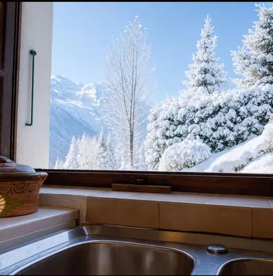 a bedroom with a bed and a window and a lamp at Family House With Balcony Garden Wi Fi in Chamonix-Mont-Blanc