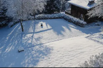 a snow covered mountain range with trees and mountains at Family House With Balcony Garden Wi Fi in Chamonix-Mont-Blanc
