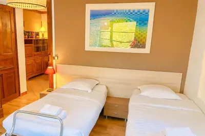 a living room with a red couch and a window at Family House With Balcony Garden Wi Fi in Chamonix-Mont-Blanc