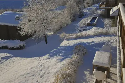 a bedroom with two beds and a picture on the wall at Family House With Balcony Garden Wi Fi in Chamonix-Mont-Blanc