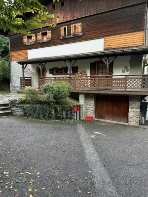 a building with a balcony on the side of it at Chalet Belle-Sofianna in Saint-Gervais-les-Bains