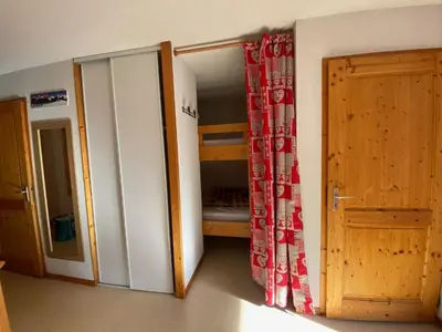 a living room with a couch and a table and a kitchen at Appartement 6 personnes avec balcon proche jardin d'enfants - FR-1-642-62 in Morillon