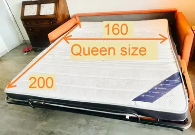 a bed with a queen size mattress in a room at Vintage chic -central, wifi, mountain view-BelleVue3 in Les Carroz d'Araches