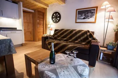 a living room with a couch and a table at Apartment Blaitiere - luxurious 2 bed apartment in Chamonix-Mont-Blanc