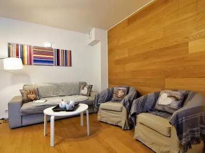 a living room with two couches and a table at Apartment Le Paccard-2 by Interhome in Chamonix-Mont-Blanc
