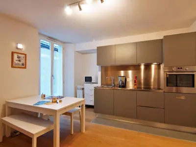 a kitchen with a table and a table and a table and a table sidx sidx at Apartment Le Paccard-2 by Interhome in Chamonix-Mont-Blanc