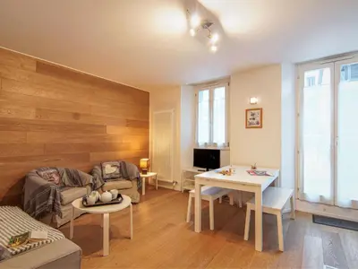 a living room with a couch and a table at Apartment Le Paccard-2 by Interhome in Chamonix-Mont-Blanc