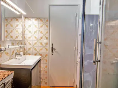 a small kitchen with a sink and a microwave at Apartment Maison Maffioli by Interhome in Chamonix-Mont-Blanc