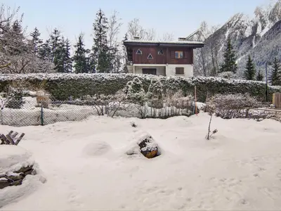 a small car parked inside of a building in the snow at Apartment Maison Maffioli by Interhome in Chamonix-Mont-Blanc