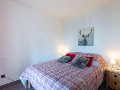a living room with a couch and a tv at Apartment Bel Alp 23 by Interhome in Saint-Gervais-les-Bains