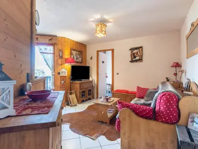 a large apartment building with a parking lot at Apartment Bel Alp 23 by Interhome in Saint-Gervais-les-Bains