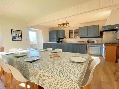a dining room with a table and chairs in a kitchen at Appartement pour 14 pers, rénové, animaux acceptés, parking - FR-1-624-92 in Samoëns
