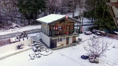 a small building with snow on the ground at Calme et sérénité - établissement classé in Sixt