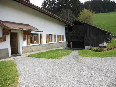 a house with a gravel driveway in front of it at La Tour in Combloux