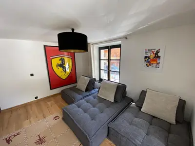 a living room with two couches and a couch at Le Marti in Chamonix-Mont-Blanc