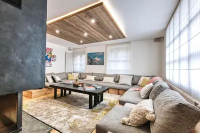 a living room with a couch and a table at Le Marti in Chamonix-Mont-Blanc