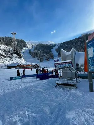 a group of people on a ski slope in the snow at Plein Soleil 3 bedroom apartment with stunning mountain views in Samoëns