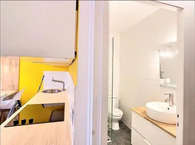 a bathroom with a sink and a toilet at Centre Saint-Gervais studio Jaune moderne proche télécabine 2 pers in Saint-Gervais-les-Bains