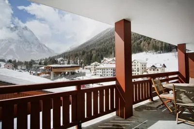 a balcony with a view of a snow covered mountain at Le REFUGE DES PORTES DU MONT BLANC in Vallorcine