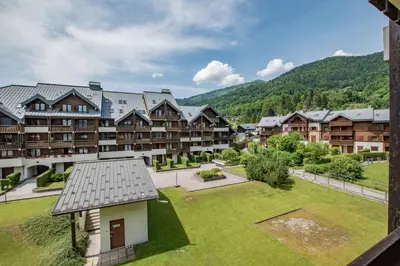 an aerial view of a resort with a yard at Studio Ella au cœur du village in Samoëns