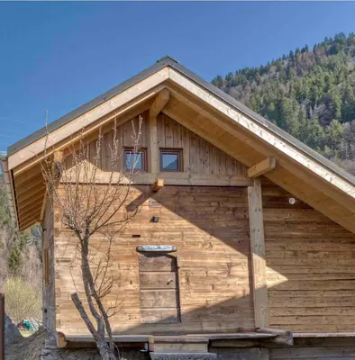 a wooden cabin with a gambrel roof at Mazot savoyard situé à 25 kms de CHAMONIX in Saint-Gervais-les-Bains