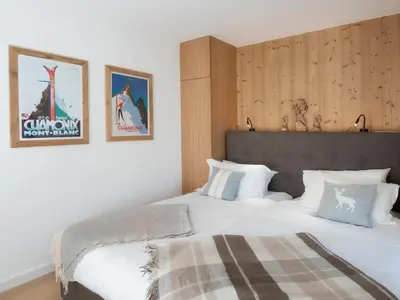 a bedroom with a large bed with white pillows at La Cordee 623-Luxury apartment with mountain view and SPA in Chamonix-Mont-Blanc