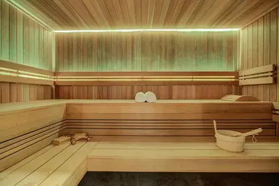 a wooden sauna with a wooden bench in it at La Cordee 623-Luxury apartment with mountain view and SPA in Chamonix-Mont-Blanc