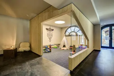 a childrens room with a play area with a window at La Cordee 623-Luxury apartment with mountain view and SPA in Chamonix-Mont-Blanc